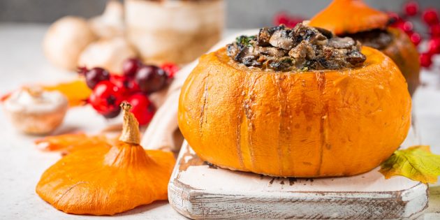 Oven-roasted pumpkin stuffed with mushrooms, spinach, cheese and cream