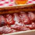 Сардельки, запечённые с томатным соусом в духовке