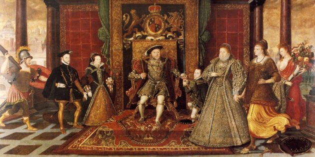Генрих VIII сидит на троне на красном ковре