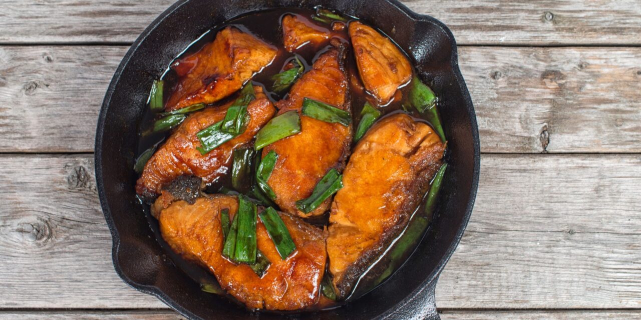 Vietnamese-style caramelized salmon in a frying pan