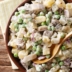 Селёдочный салат с&nbsp;картофелем, горошком и&nbsp;солёными огурцами